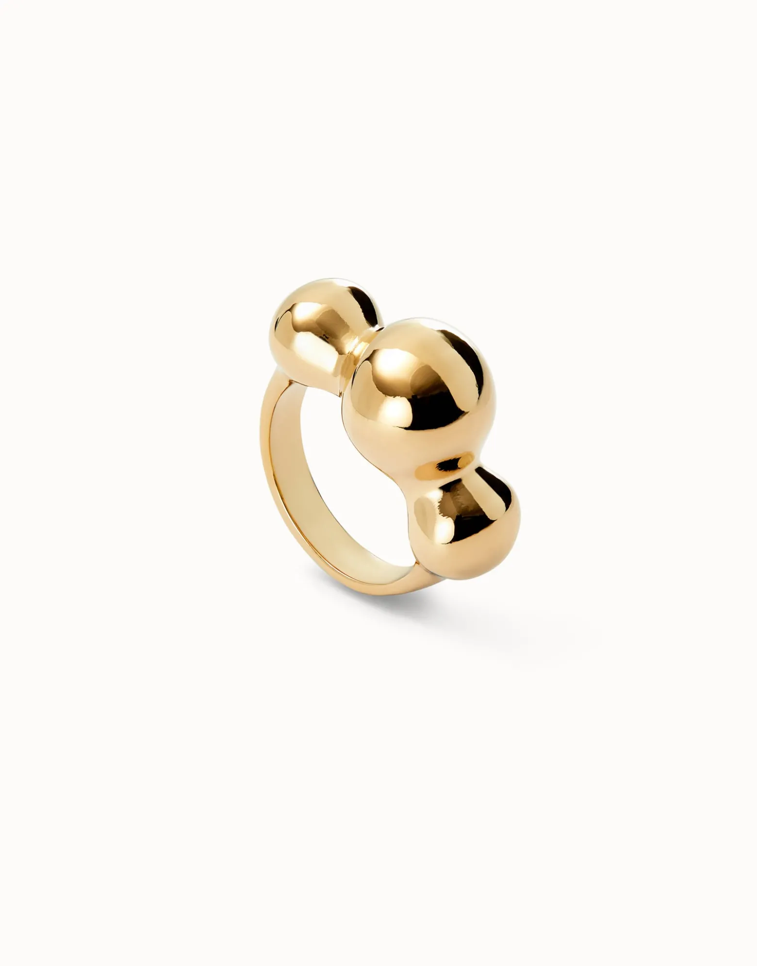 Anillo bañado en oro 18k y tres bolas centrales