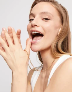 Cadena larga de bolas bañada en oro 18k.