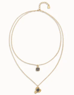 Colgante bañado en oro 18k con doble cadena y corazones con cristal negro