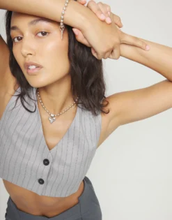 Collar con bolas bañado en plata de ley y detalle de corazón