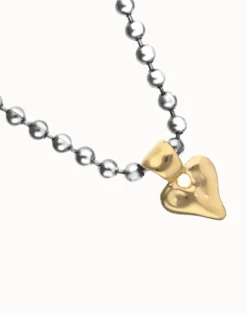 Collar de bolas bañada en plata con detalle de corazón en oro 18k