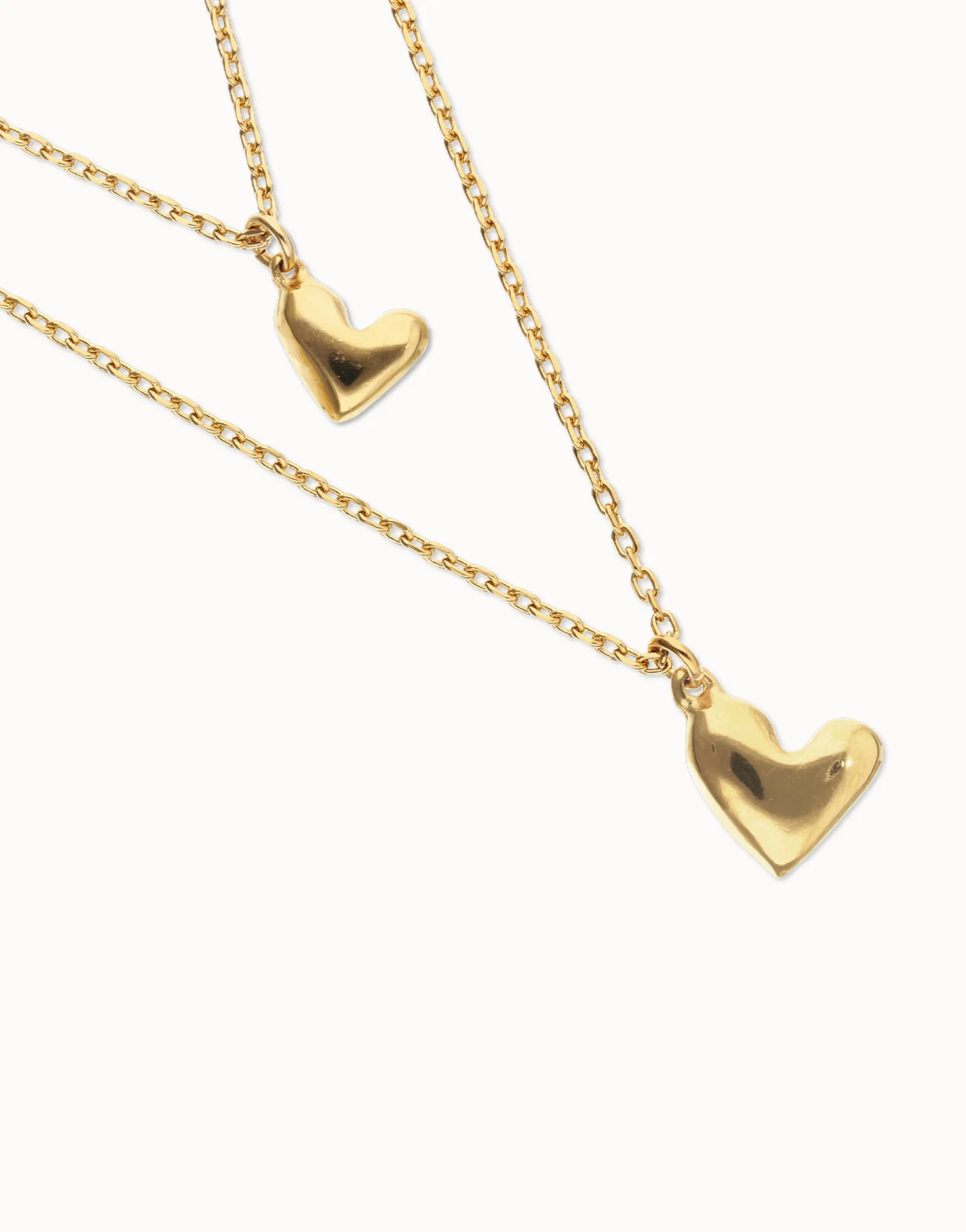 Collar doble bañado en oro 18k con dos corazones