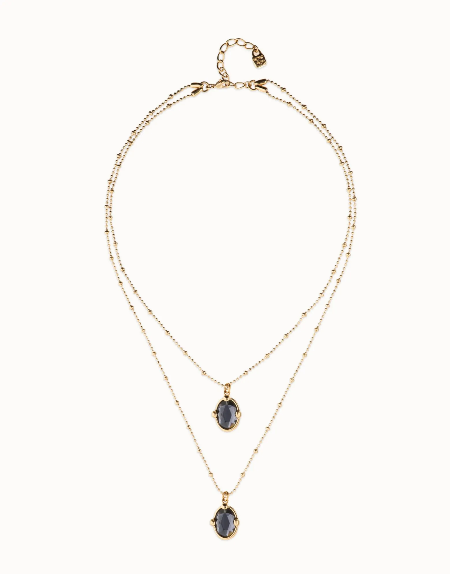Collar doble bañado en oro 18k con dos cristales facetados ovalados negros