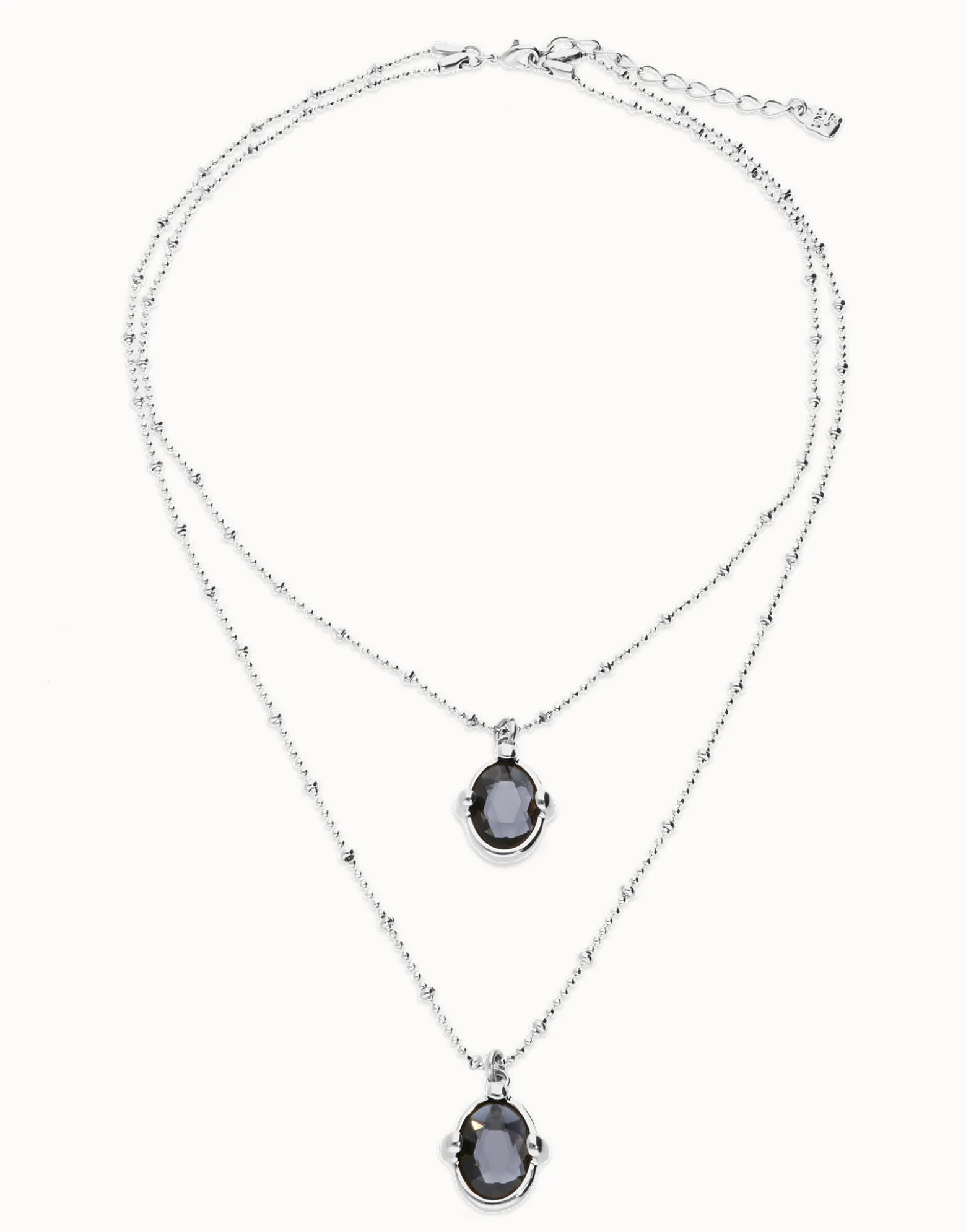 Collar doble bañado en plata con dos cristales facetados ovalados negros