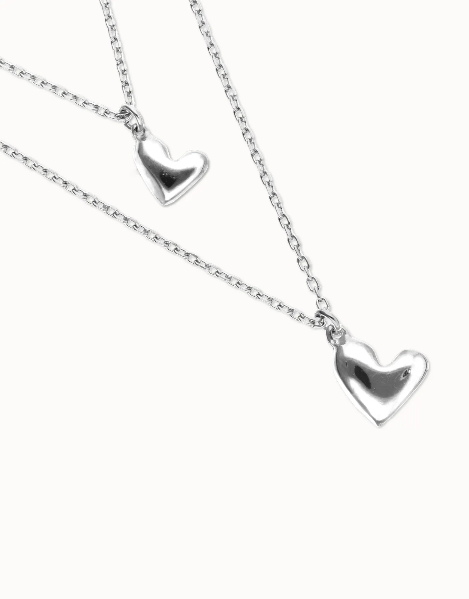 Collar doble bañado en plata de ley con dos corazones