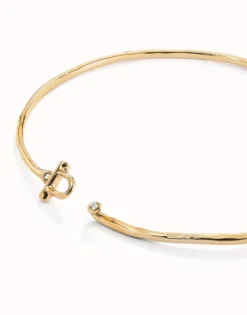 Collar rígido con cierre frontal bañado en oro 18k con topacio blanco