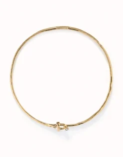 Collar rígido con cierre frontal bañado en oro 18k con topacio blanco