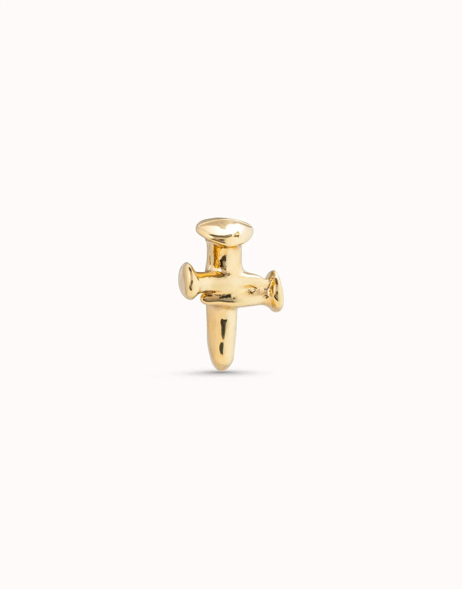 Piercing bañado en oro de 18k de cruz