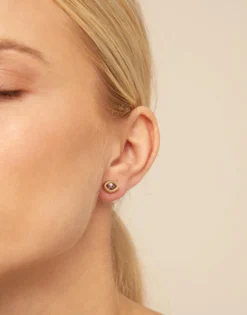 Piercing bañado en oro de 18k y un cristal morado