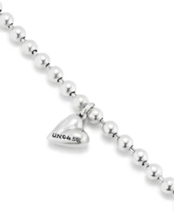 Pulsera bañada en plata de ley con bolas y charm de corazón