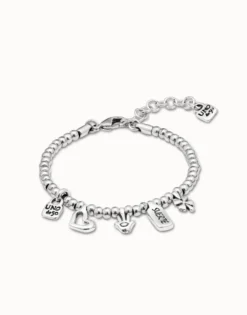 Pulsera bañada en plata de ley con charm corazón, trébol y mano