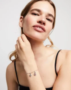 Pulsera con bolas y piezas alargadas bañada en plata de ley