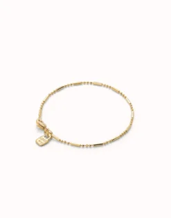 Pulsera con bolas y piezas alargadas bañada en oro 18k