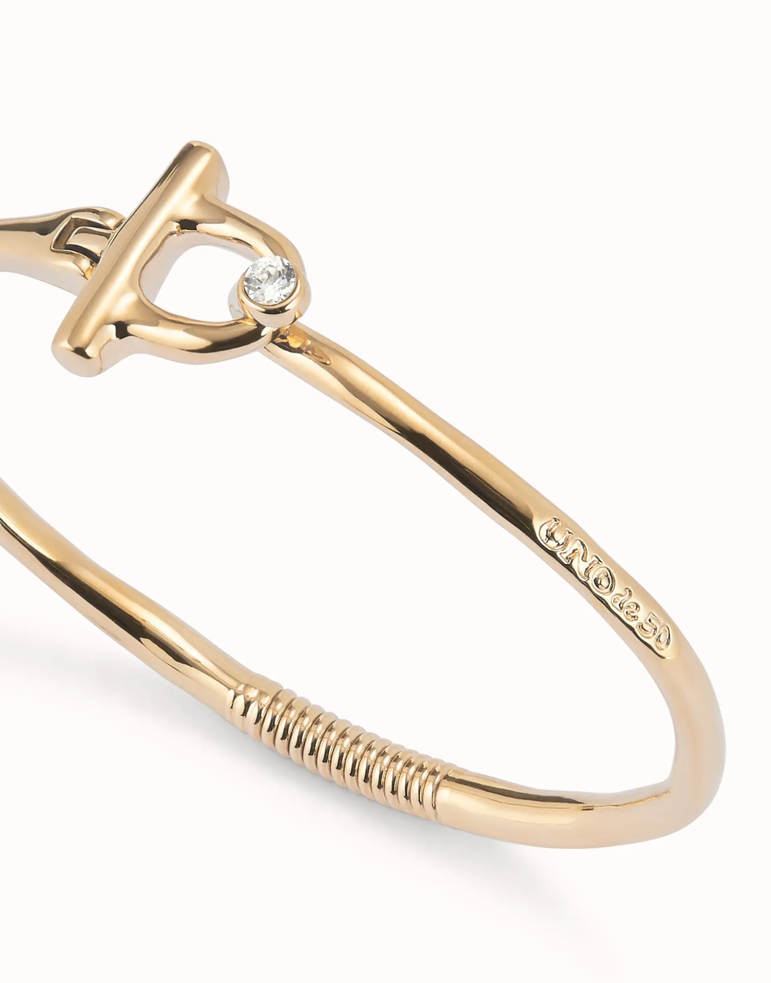 Pulsera con cierre frontal bañada en oro 18k con topacio blanco