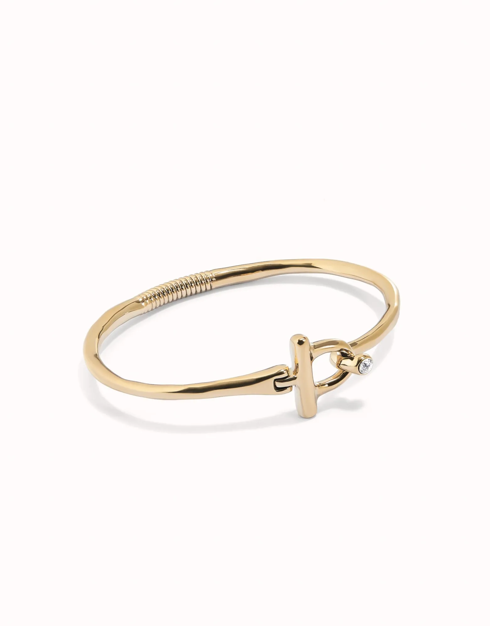 Pulsera con cierre frontal bañada en oro 18k con topacio blanco