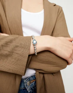 Pulsera de bolas bañada en plata con cristal facetado ovalado azul