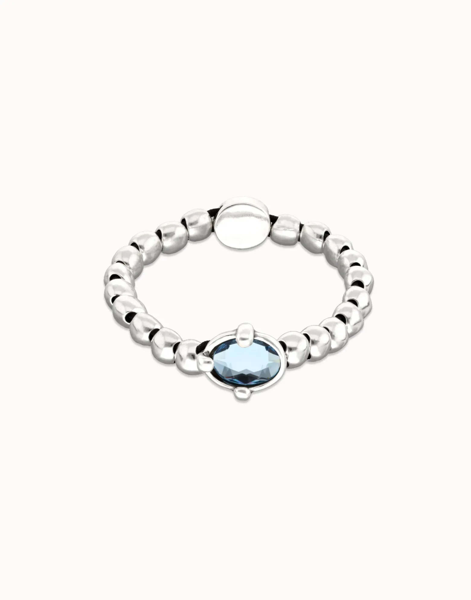 Pulsera de bolas bañada en plata con cristal facetado ovalado azul