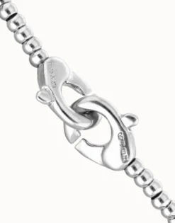Pulsera de bolas pequeñas bañada en plata con mosquetón entrelazado