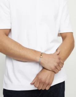 Pulsera de cuero azul con mosquetón entrelazado en oro