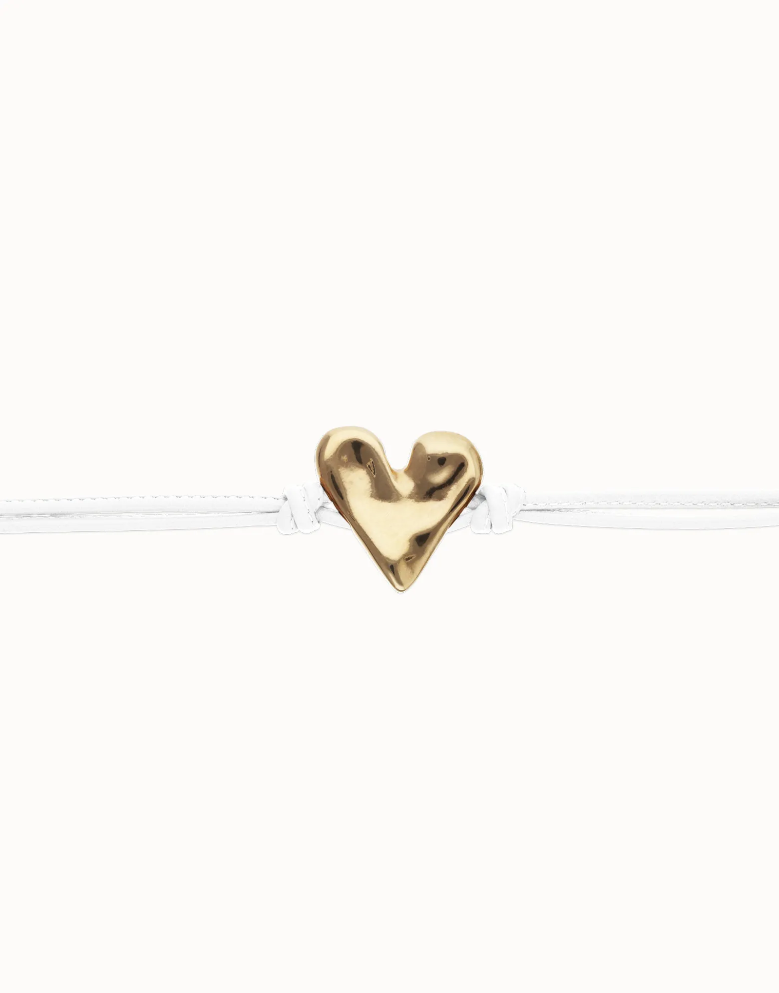 Pulsera de cuero blanco con detalle de corazón bañado en oro 18k