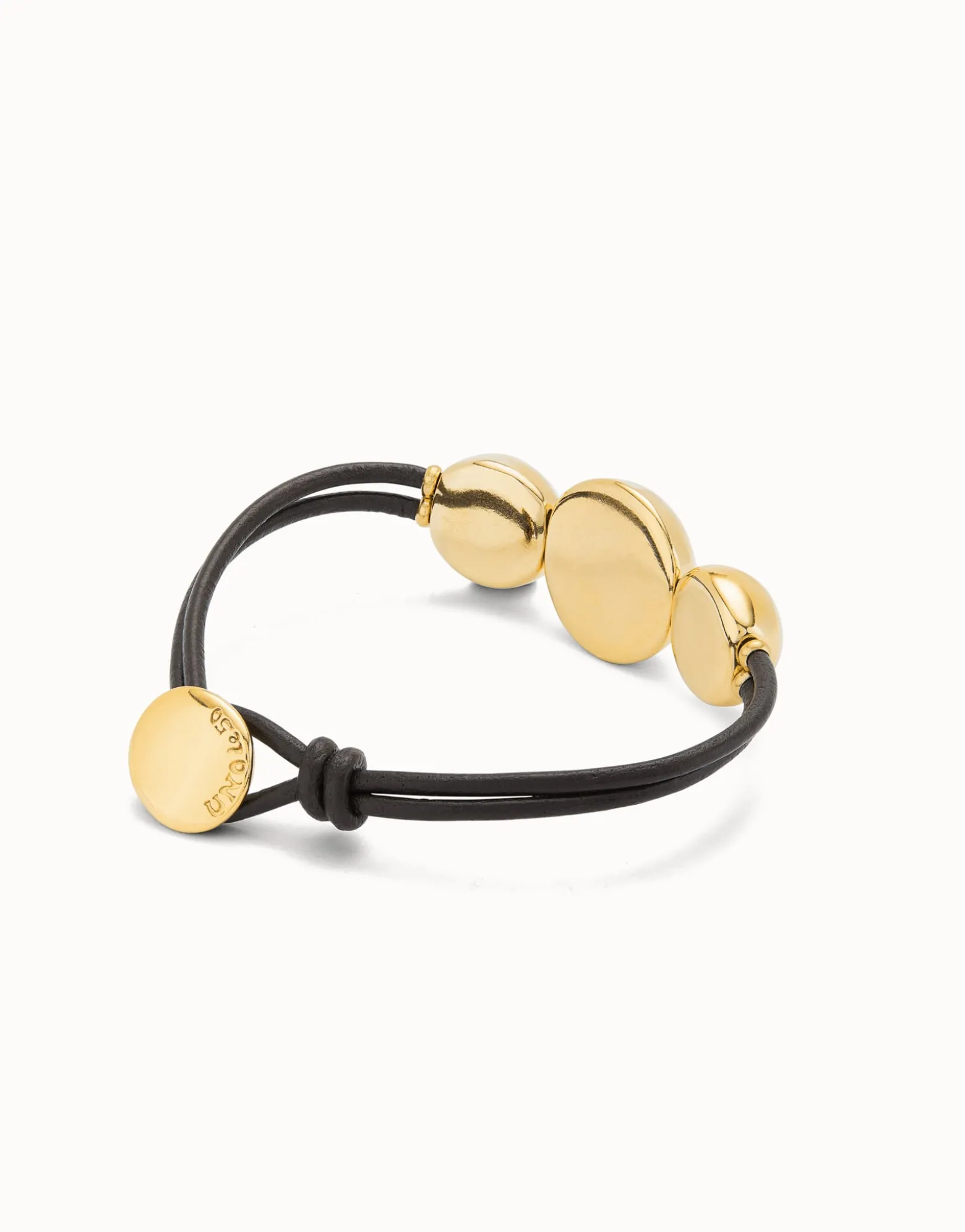 Pulsera de cuero con tres bolas grandes bañadas en oro 18k