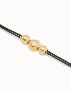 Pulsera de cuero con tres bolas grandes bañadas en oro 18k