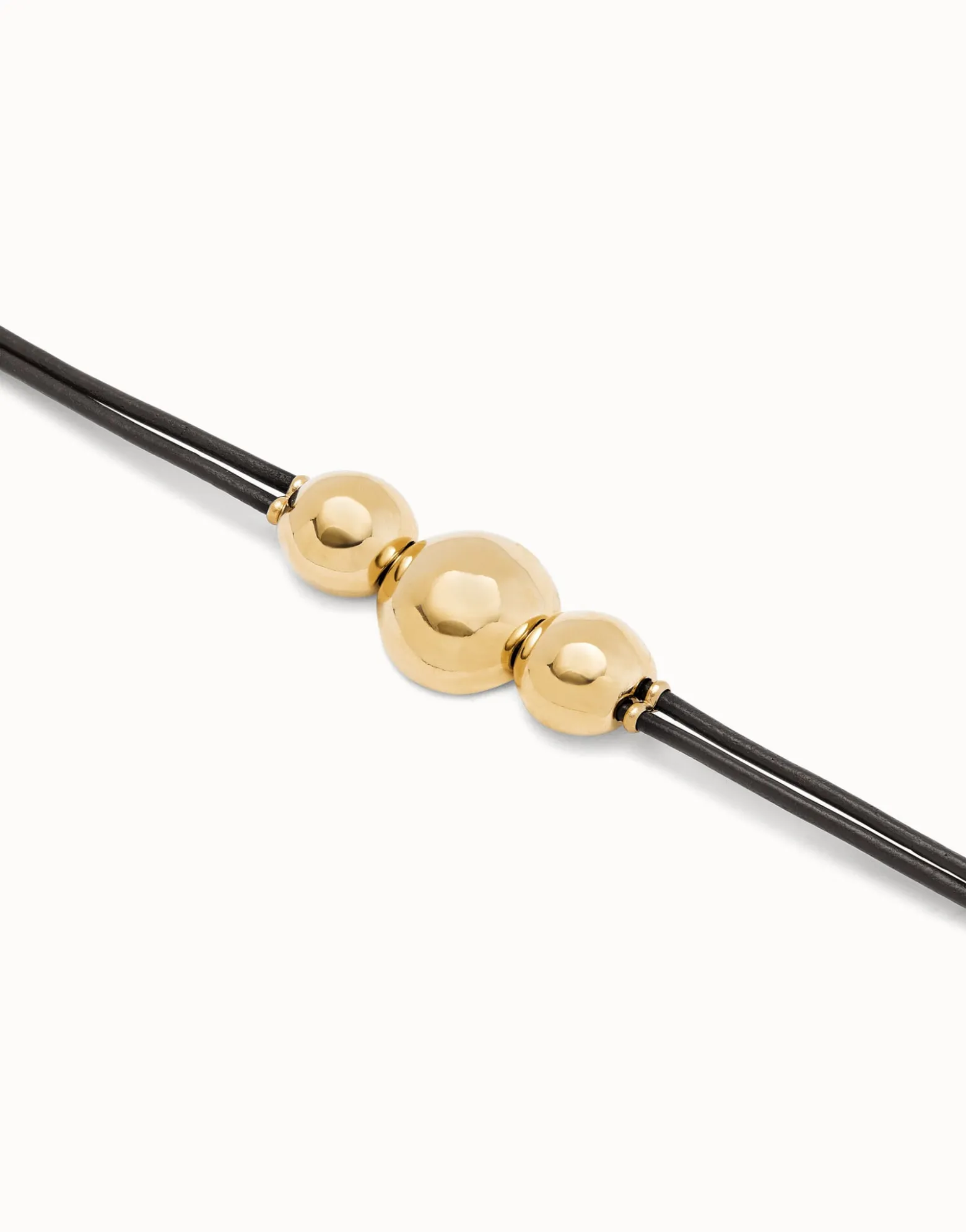 Pulsera de cuero con tres bolas grandes bañadas en oro 18k