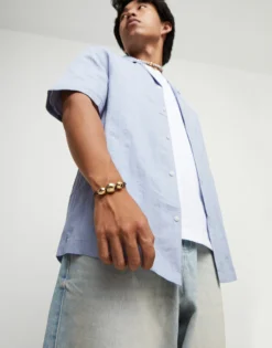 Pulsera de cuero con tres bolas grandes bañadas en oro 18k