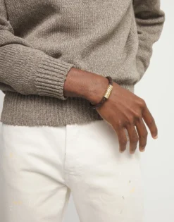 Pulsera de cuero trenzado marrón y detalle bañado en oro 18k