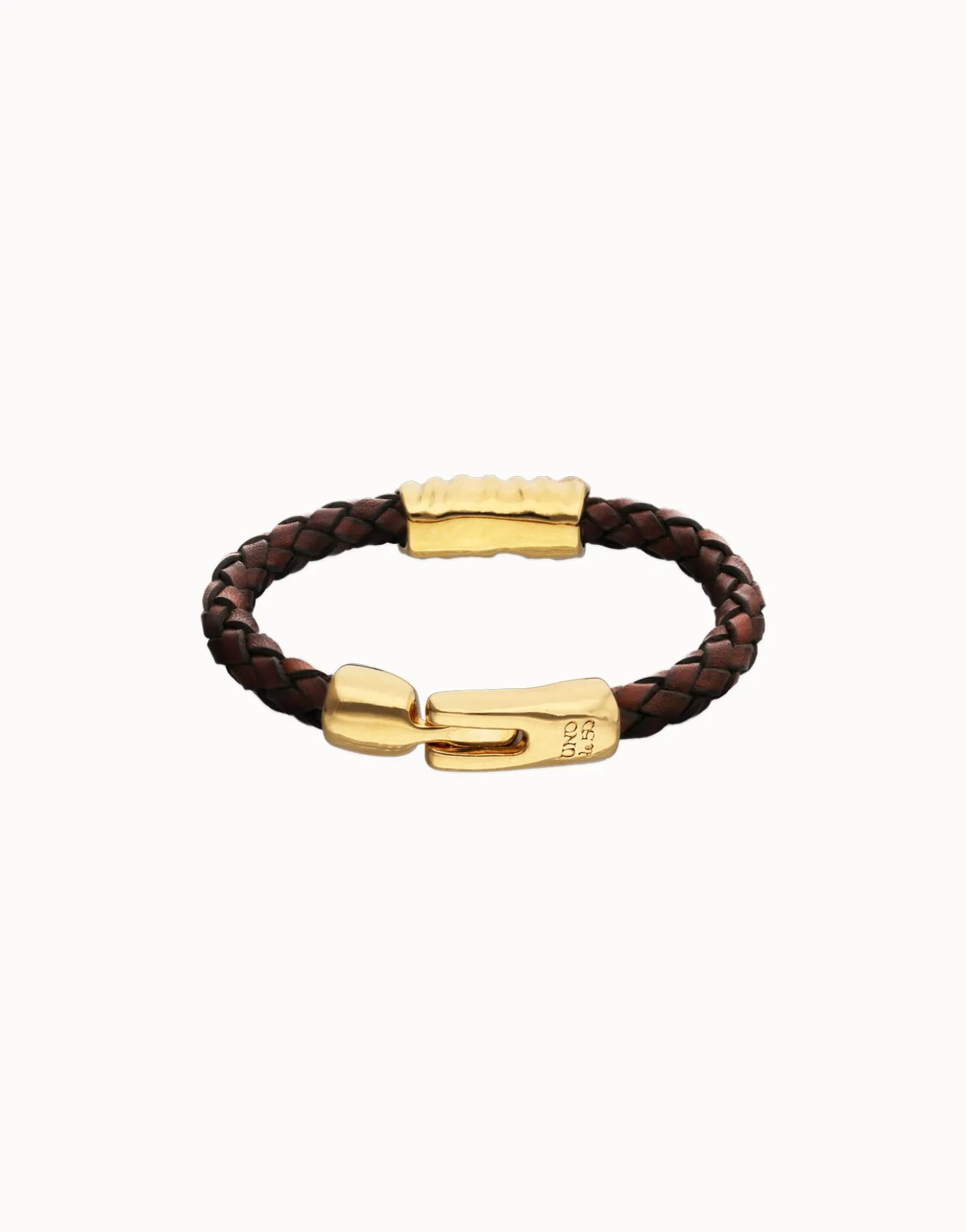 Pulsera de cuero trenzado marrón y detalle bañado en oro 18k