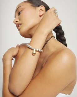 Pulsera de esferas medianas combinando baño en oro y en plata