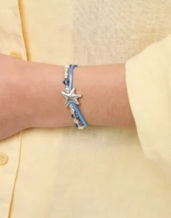 Pulsera de hilo de seda en color azul bañada en plata con estrella de mar