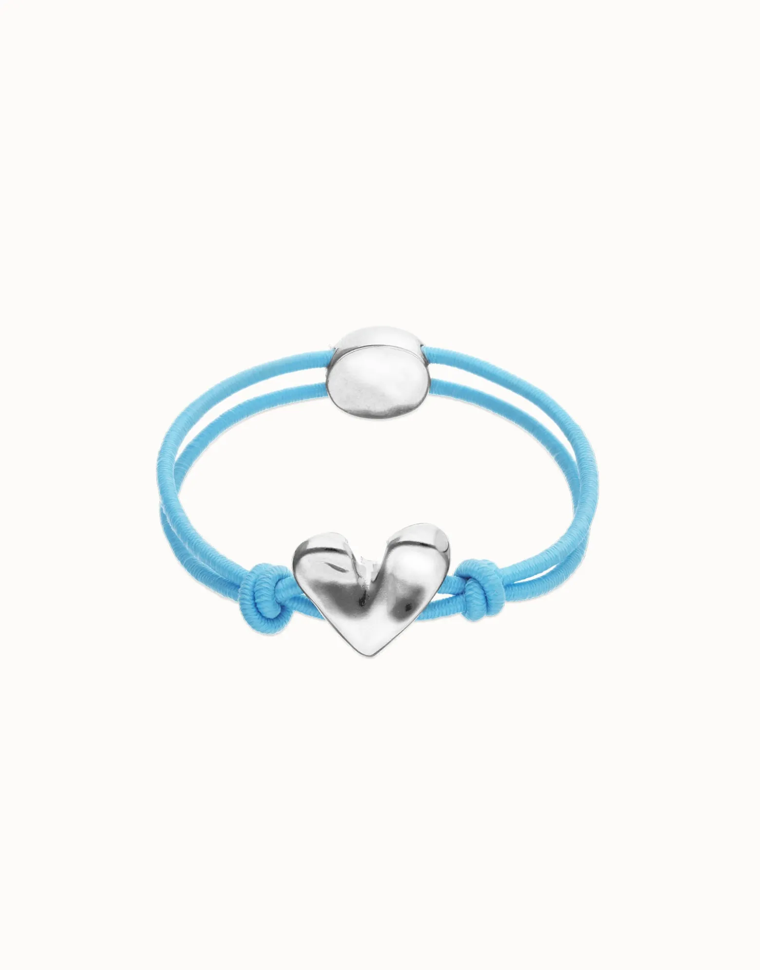 Pulsera de hilo elástico azul con corazón bañado en plata de ley