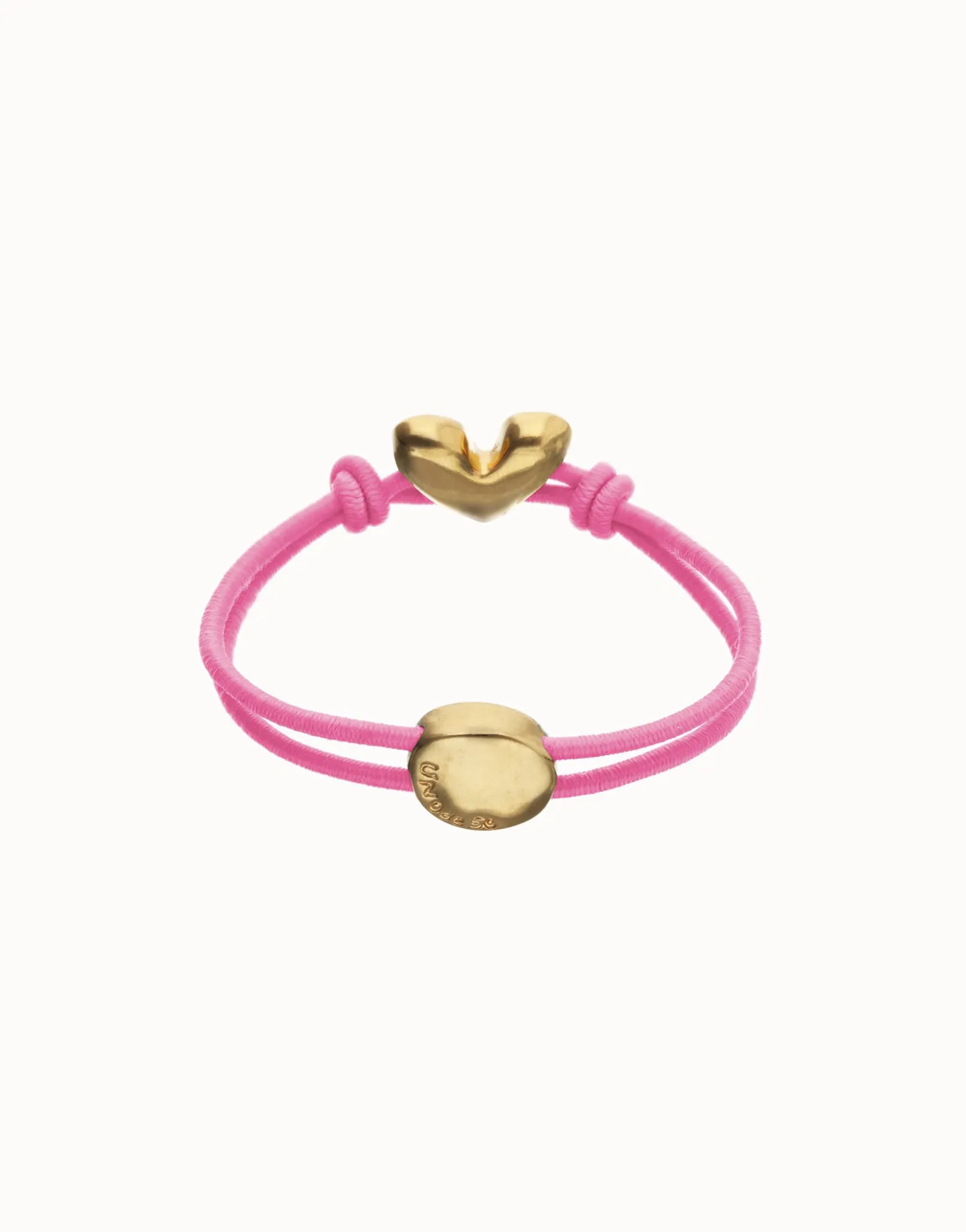 Pulsera de hilo elástico rosa con corazón bañado en oro 18k