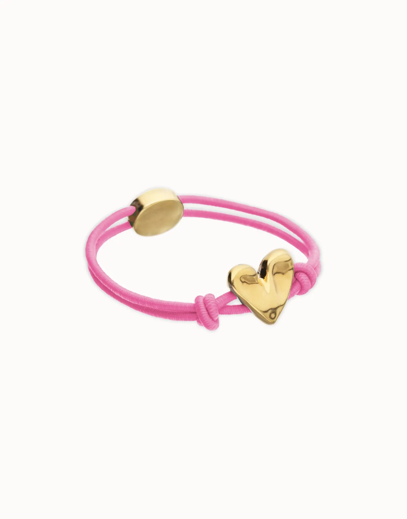 Pulsera de hilo elástico rosa con corazón bañado en oro 18k