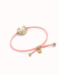 Pulsera de hilo fucsia con perla shell fornitura bañada en oro 18k.