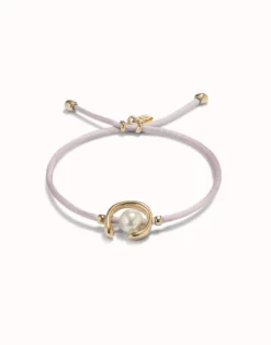 Pulsera de hilo lila con perla shell fornitura bañada en oro 18k.