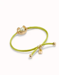 Pulsera de hilo lima con perla shell fornitura bañada en oro 18k.