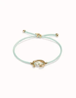 Pulsera de hilo verde azulado con perla shell fornitura bañada en oro 18k.