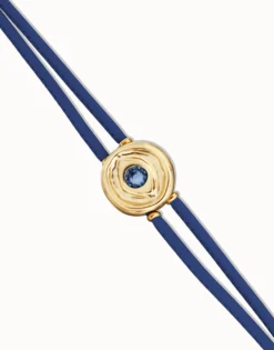 Pulsera doble de cuero azul con ojo bañado en oro 18k