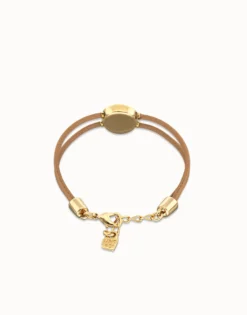 Pulsera doble de cuero crema con ojo bañado en oro 18k