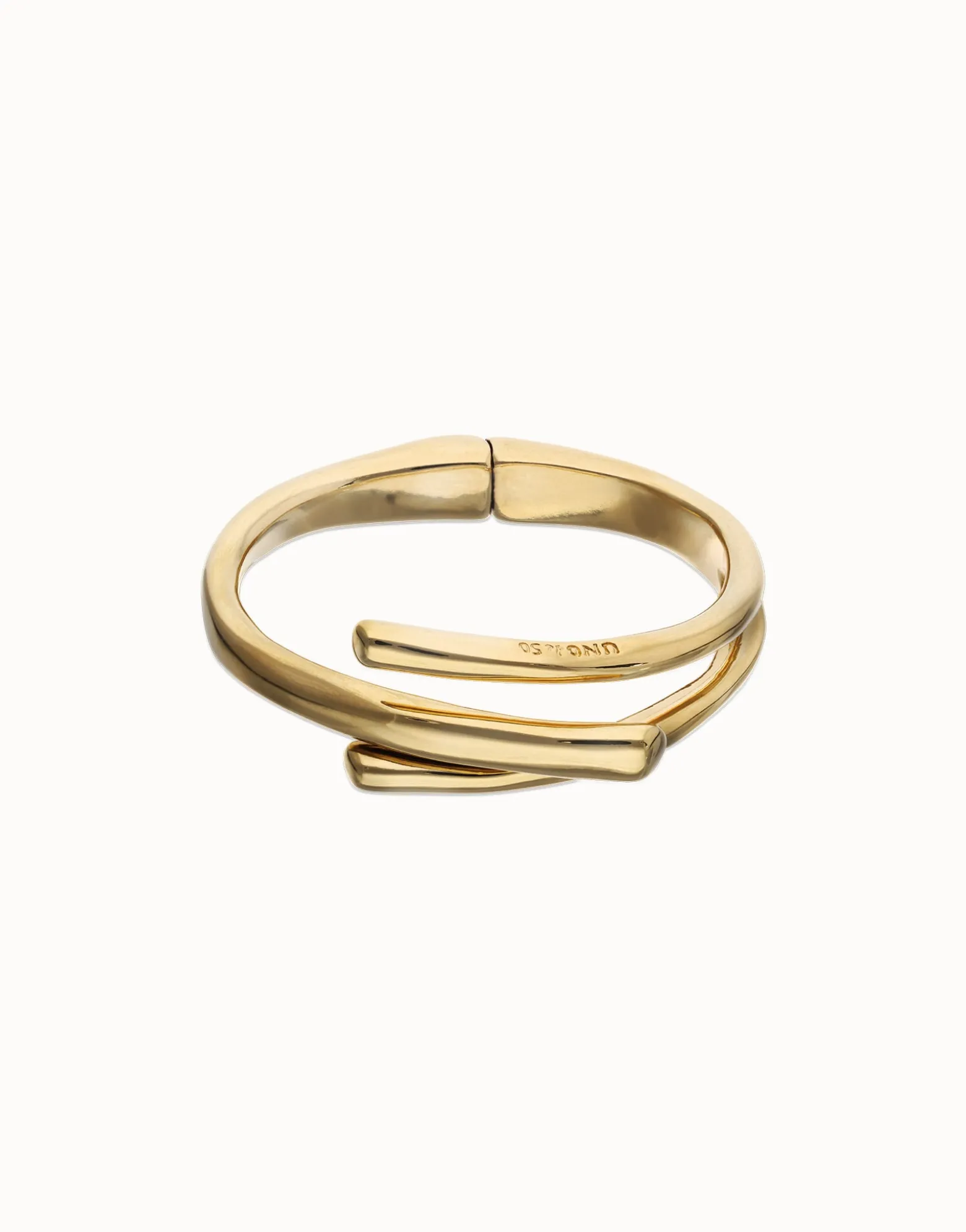 Pulsera rígida bañada en oro 18k con tres formas orgánicas entrelazadas