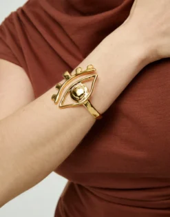 Pulsera rígida bañada en oro 18k con detalle de ojo