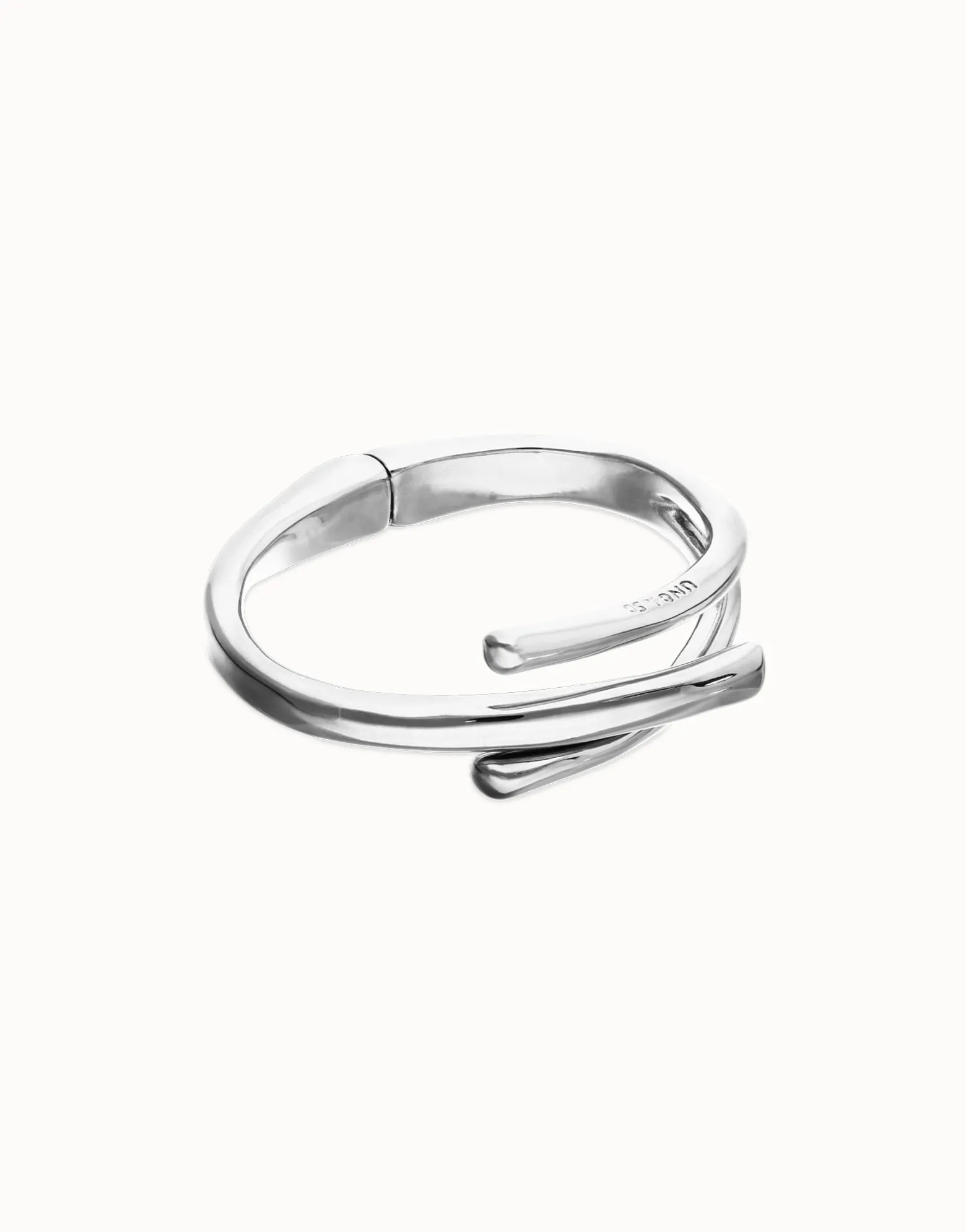 Pulsera rígida bañada en plata de ley con tres formas orgánicas entrelazadas