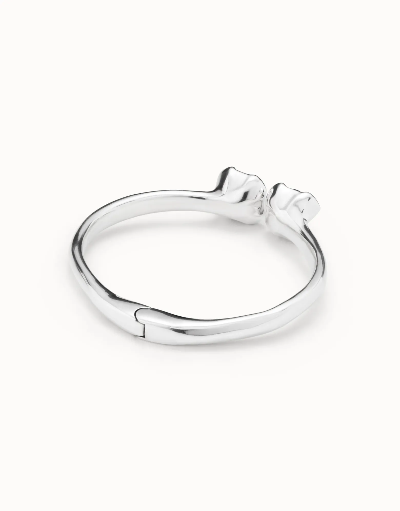 Pulsera rígida bañada en plata de ley, con muelle interior y dos cristales azules