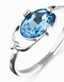 Pulsera rígida bañada en plata de ley con cristal facetado azul