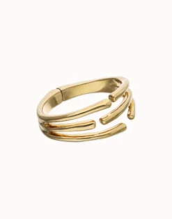 Pulsera rígida con múltiples formas orgánicas entrelazadas bañada en oro 18k