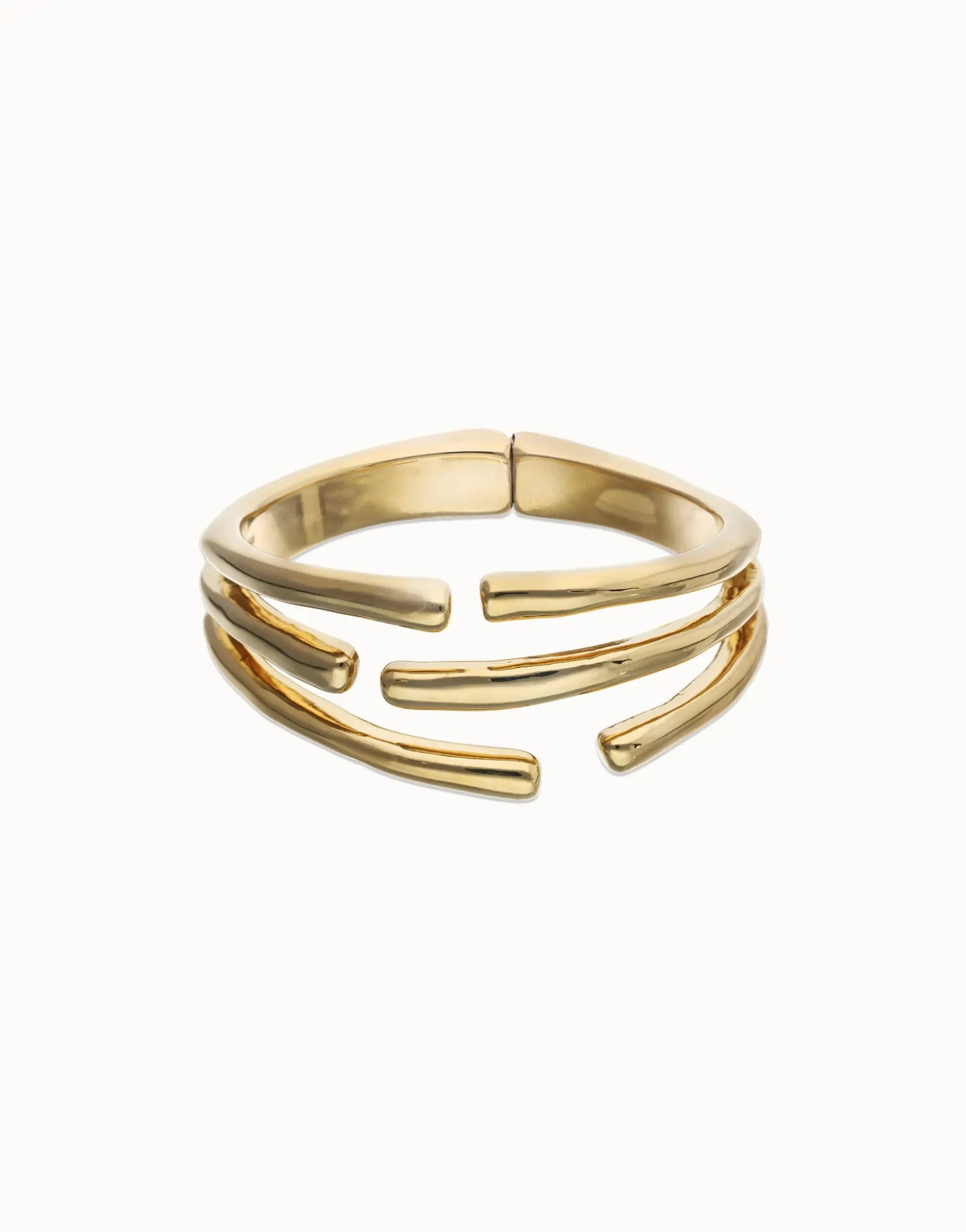 Pulsera rígida con múltiples formas orgánicas entrelazadas bañada en oro 18k