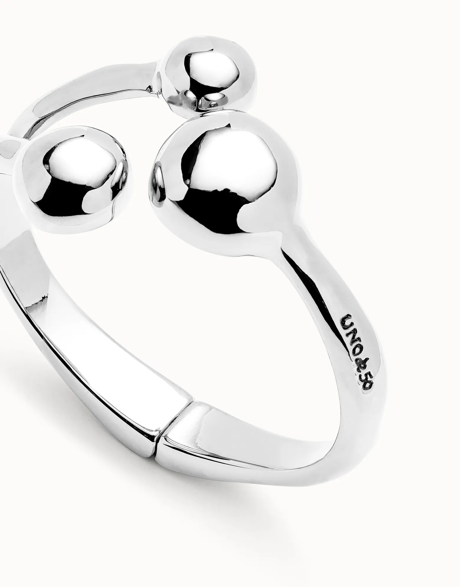 Pulsera rígida con tres bolas bañadas en plata de ley