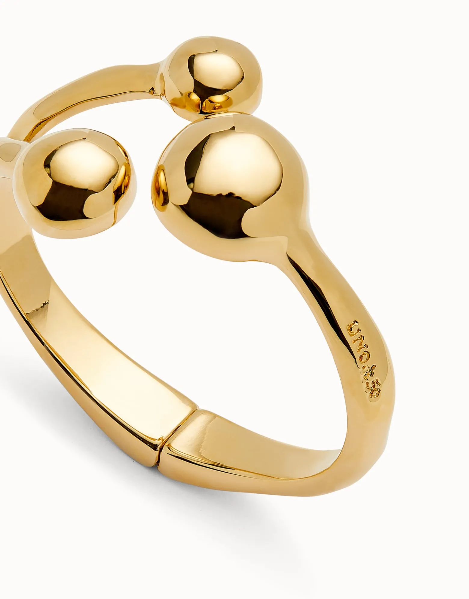 Pulsera rígida con tres bolas bañadas en oro 18k